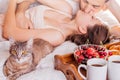 Couple having breakfast in bed Royalty Free Stock Photo