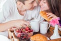Couple having breakfast in bed Royalty Free Stock Photo