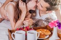 Couple having breakfast in bed Royalty Free Stock Photo