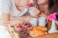 Couple having breakfast in bed Royalty Free Stock Photo