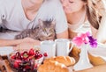 Couple having breakfast in bed Royalty Free Stock Photo