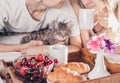 Couple having breakfast in bed Royalty Free Stock Photo