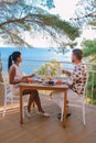 Couple having breakfast in garden looking out over the hills of Sicily, men and woman of mid age on vacation having Royalty Free Stock Photo