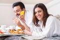 Couple having breakfast in hotel room. Royalty Free Stock Photo