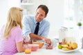 Couple Having Breakfast Before Husband Leaves For Work Royalty Free Stock Photo