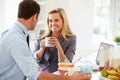 Couple Having Breakfast Together Before Leaving For Work Royalty Free Stock Photo