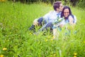 Couple having a candid romantic kiss in the grass