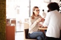 A couple having coffee at a cafe bar Royalty Free Stock Photo