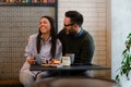 Couple having coffee at a coffee shop. Royalty Free Stock Photo