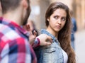 Couple having a conflict on a street