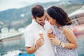 Couple having date and eating ice cream on vacation. Sea background Royalty Free Stock Photo