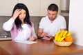 Couple having difficult to calculate expenses Royalty Free Stock Photo