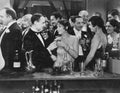 Couple Having Drink At Crowded Bar