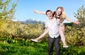 Couple having fun around bloomy trees Royalty Free Stock Photo