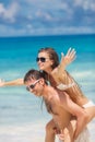 Couple having fun on the beach of a tropical ocean. Royalty Free Stock Photo