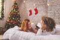 Couple having fun in bed after waking up on Christmas morning Royalty Free Stock Photo