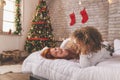 Couple having fun in bed after waking up on Christmas morning Royalty Free Stock Photo