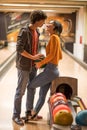 Couple having fun in bowling alley. Love and romance Royalty Free Stock Photo