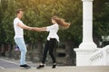 Couple having fun on a bridge in the park Royalty Free Stock Photo