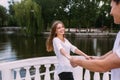 Couple having fun on a bridge in the park Royalty Free Stock Photo