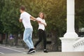 Couple having fun on a bridge in the park Royalty Free Stock Photo