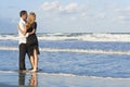 Couple Having Fun Embracing On A Beach Royalty Free Stock Photo