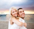 Couple having fun and hugging on beach Royalty Free Stock Photo