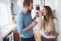 Couple having fun and laughing at home while eating ice cream Royalty Free Stock Photo