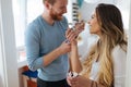 Couple having fun and laughing at home while eating ice cream Royalty Free Stock Photo