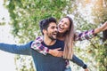 Couple having fun man giving piggyback to woman