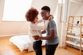 Couple Having Fun In New Home Dancing Together Royalty Free Stock Photo