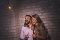 Couple having fun at New Years Eve party midnight countdown
