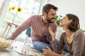 Couple having fun playing ludo board game