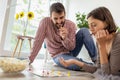 Couple having fun playing ludo