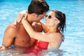 Couple Having Fun In Swimming Pool Royalty Free Stock Photo