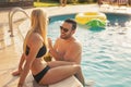 Couple having fun at the swimming pool Royalty Free Stock Photo