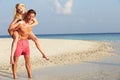 Couple Having Fun On Tropical Beach Holiday Royalty Free Stock Photo