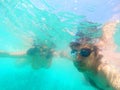 Couple having fun underwater in the sea Royalty Free Stock Photo