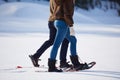 Couple having fun and walking in snow shoes Royalty Free Stock Photo