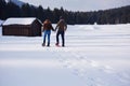 Couple having fun and walking in snow shoes Royalty Free Stock Photo