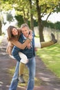 Couple Having Fun Whilst Walking In Park