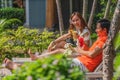 Couple having goodtime together on summer vacation in resort and hotel garden beside pool