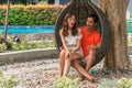 Couple having goodtime together on summer vacation in resort and hotel garden beside pool