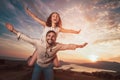 Couple having having fun in nature, behind them is a beautiful sunset over Boka Bay