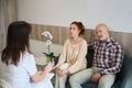 Couple having meeting with female doctor at clinic Royalty Free Stock Photo