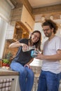 Couple having milk and cereal for breakfast