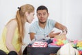 Couple having packing problems Royalty Free Stock Photo