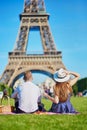 Couple having picnic near the Eiffel tower in Paris, France Royalty Free Stock Photo