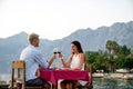 Couple is having a private event dinner on a tropical beach during sunset time Royalty Free Stock Photo