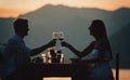 Couple is having a private event dinner on a tropical beach during sunset time Royalty Free Stock Photo